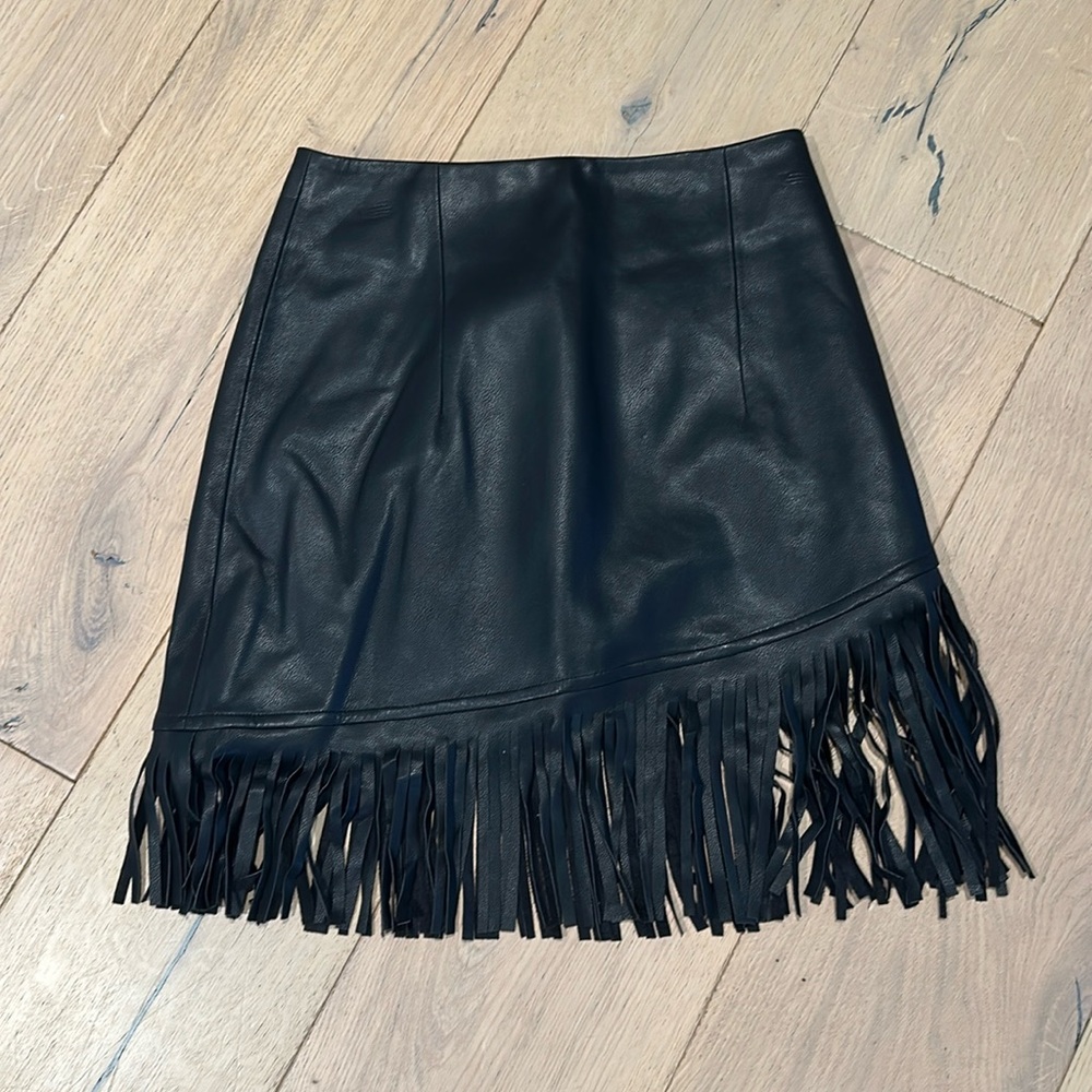 NWT. Size XS. Black vegan leather fringe mini skirt.